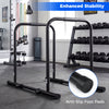 Adjustable dip bar station in black with foam-padded handles and anti-slip foot pads for home gym workouts.