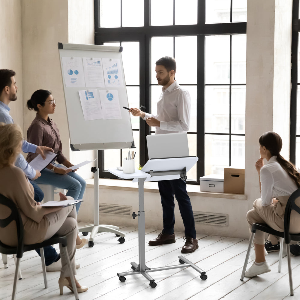 Adjustable angle height rolling laptop table in white with lockable wheels, ideal for flexible workspace needs.