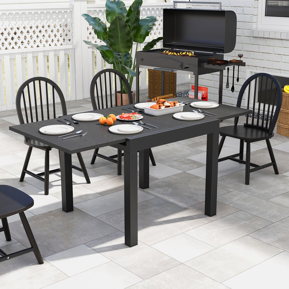 Adjustable gray patio dining table, expandable from 31.5" to 63", seating 4-6 people, perfect for outdoor use.