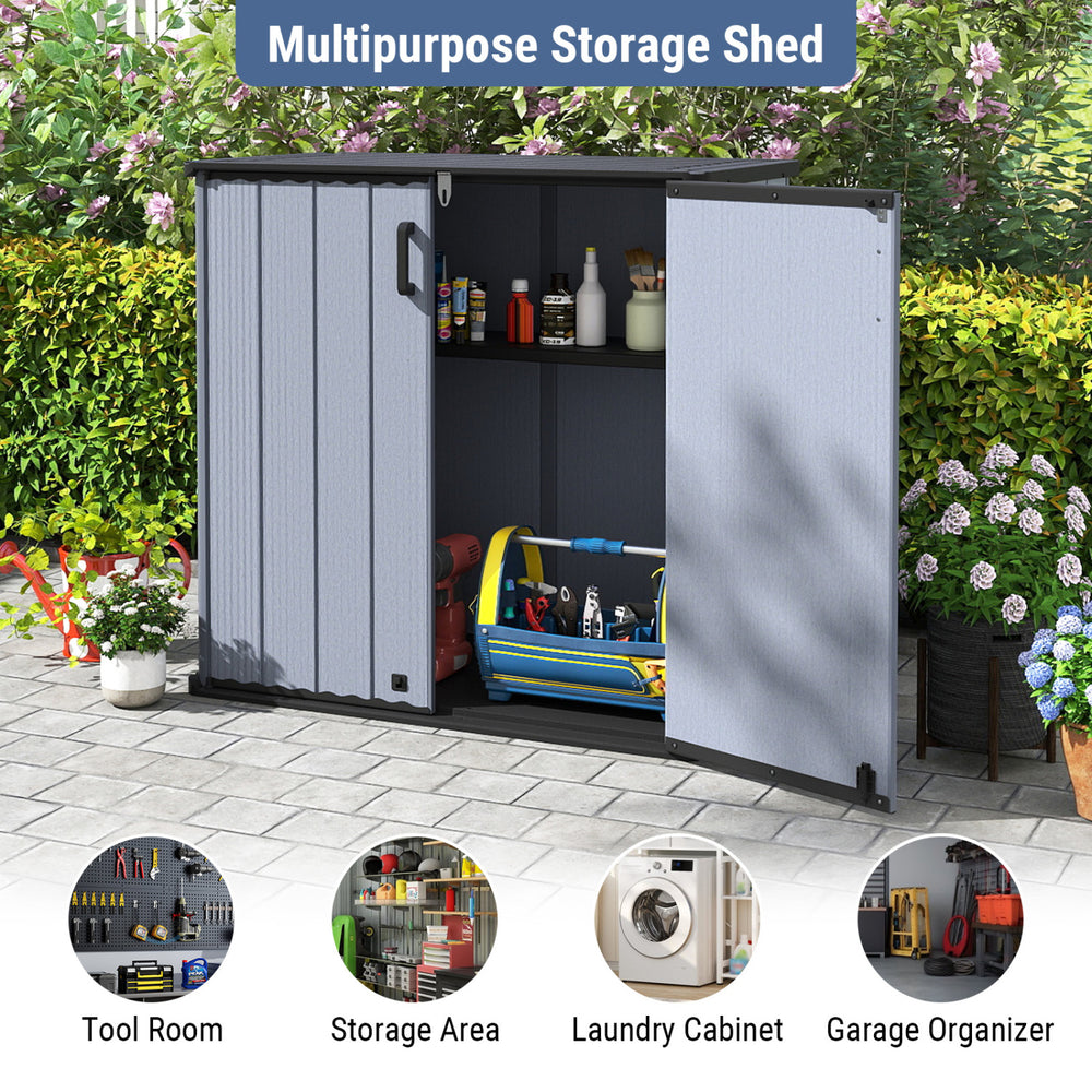 Gray all-weather storage box with removable shelf, lockable doors, and waterproof surface for outdoor organization.