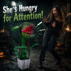 Animated Halloween man-eater plant prop with chomping motions, sharp teeth, and posable leaves for spooky decor.