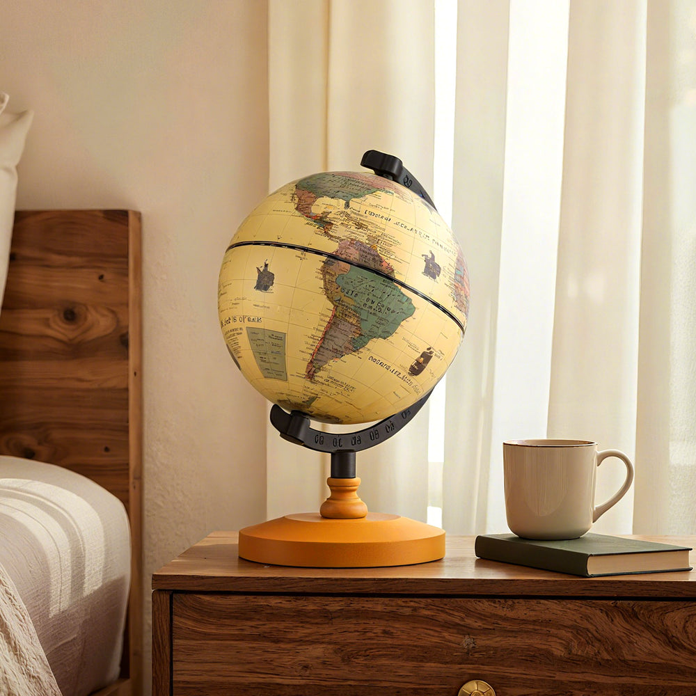 Mini rotating antique globe with a wooden base, featuring clear geographic details for educational and decorative use.