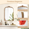 Arched vintage gold metal frame mirror with baroque ornate patterns, perfect for entryways and living rooms.