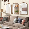 Three arched gold vintage mirrors with ornate frames, perfect for enhancing entryways and living room decor.
