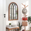 Arched window finished mirror with natural frame, enhancing ambiance and providing a crystal-clear reflection for any.