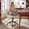 Armless office chair with curved backrest and padded seat in white, ideal for desk use and space-saving design.