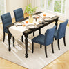 Elegant dark blue tufted dining chair with rubber wood legs, showcasing breathable fabric and stylish button detailing.