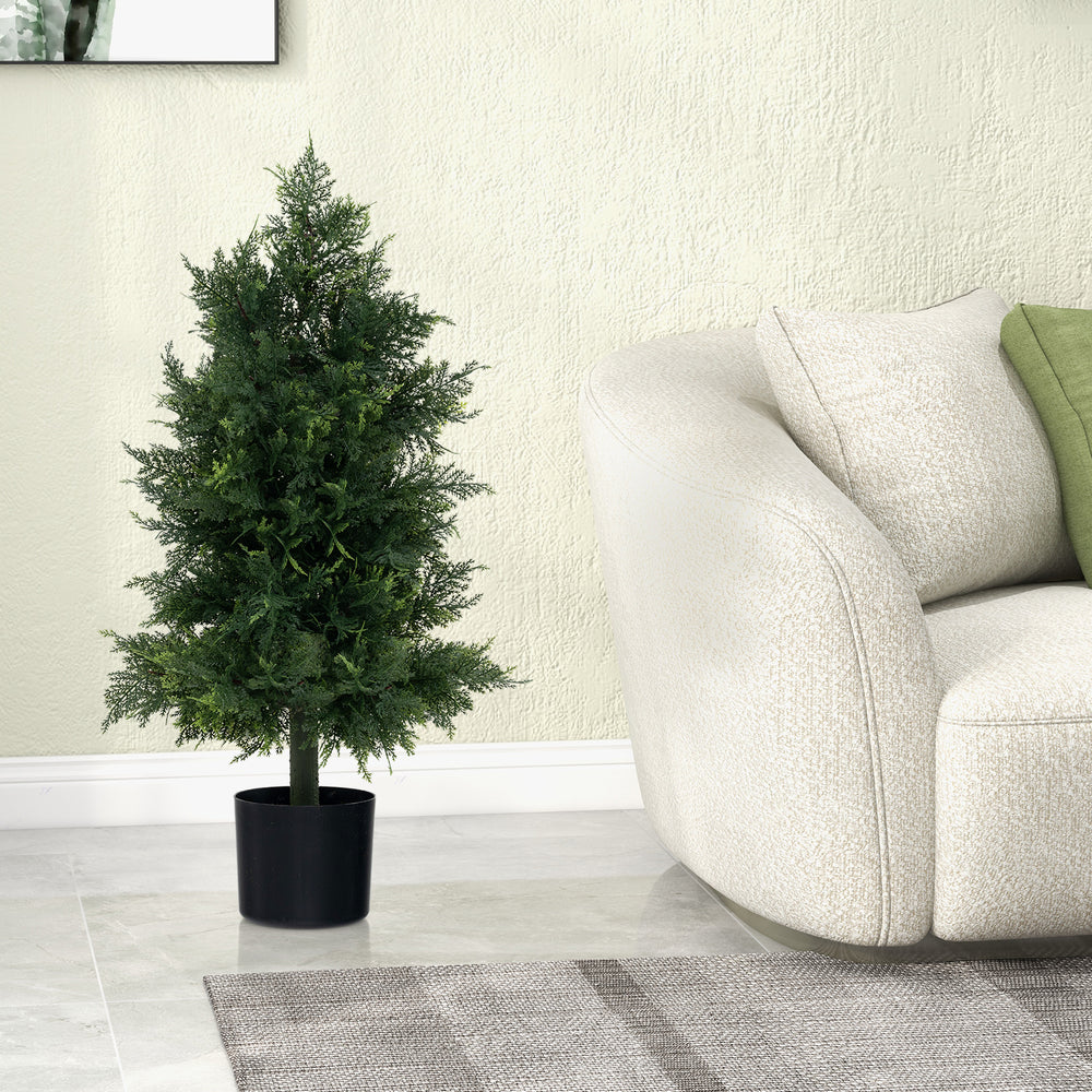 Artificial cedar topiary tree in a black nursery pot, ideal for office or porch decor, featuring realistic leaves.