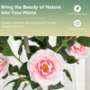 Artificial camellia tree with pink flowers and 116 vibrant leaves, perfect for home or office decoration.