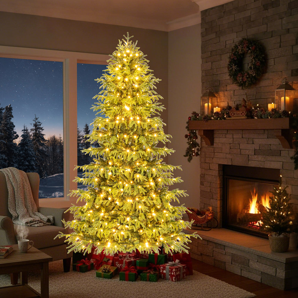 Artificial Christmas tree with warm white LED lights, featuring dense PVC mixed branch tips for festive home decoration.