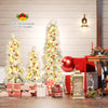 Three artificial Christmas trees with snow-flocked tips and warm white LED lights, perfect for festive holiday decor.