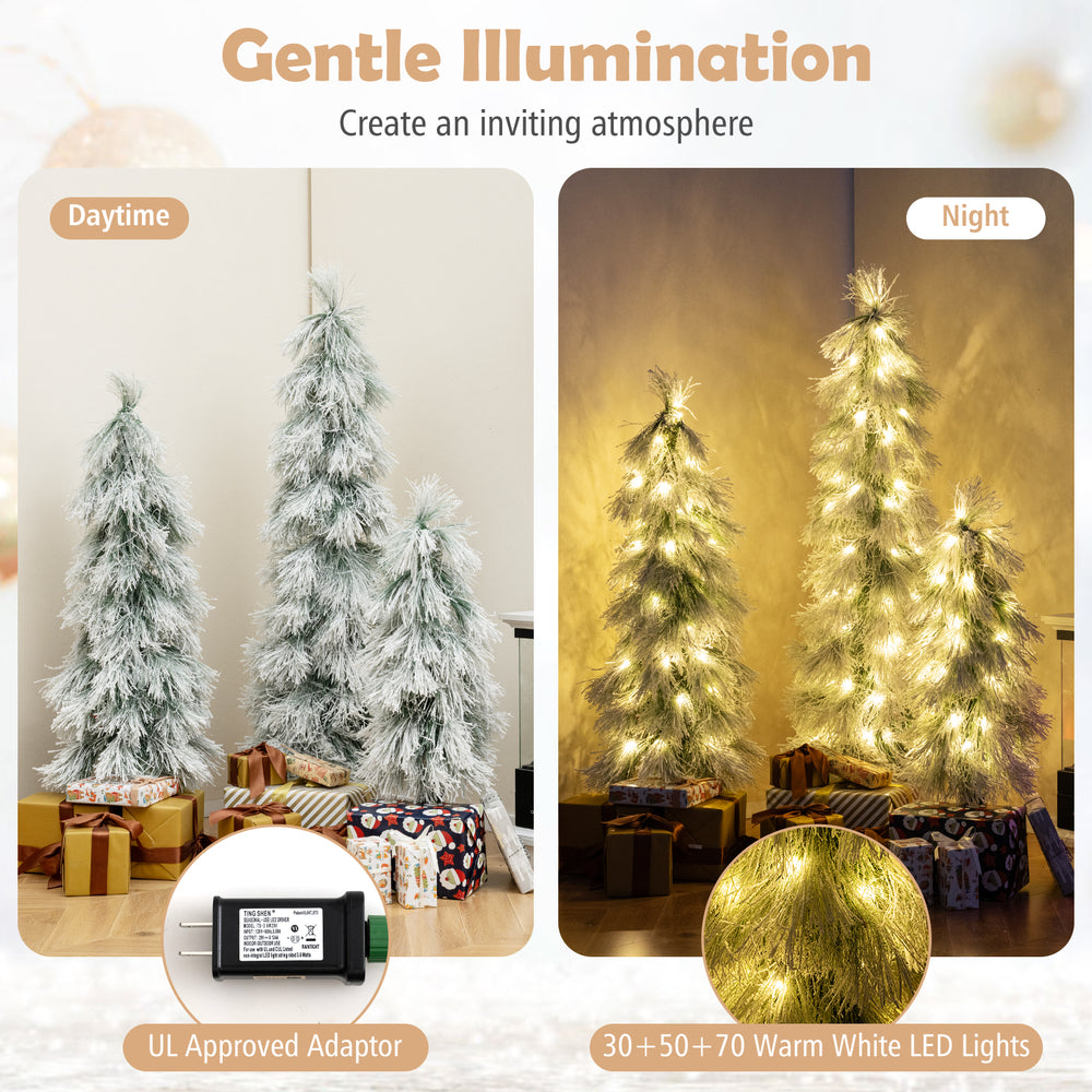 Single artificial Christmas tree with snow-flocked branch tips and warm white LED lights, ideal for festive home decor.