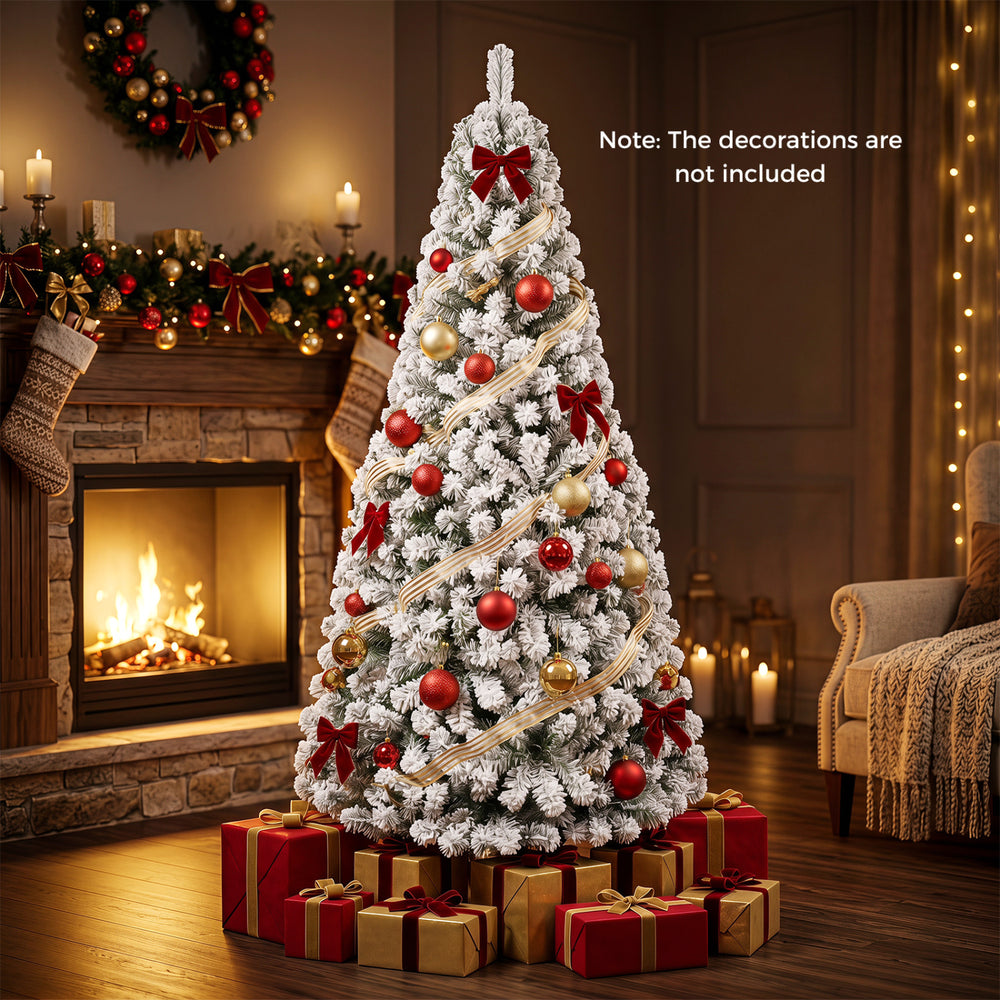 Snow-flocked 6 ft artificial Christmas tree with lush branch tips, perfect for indoor holiday decoration and gatherings.