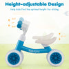 Baby balance bike in blue with height-adjustable seat and handlebars, designed for indoor and outdoor fun.