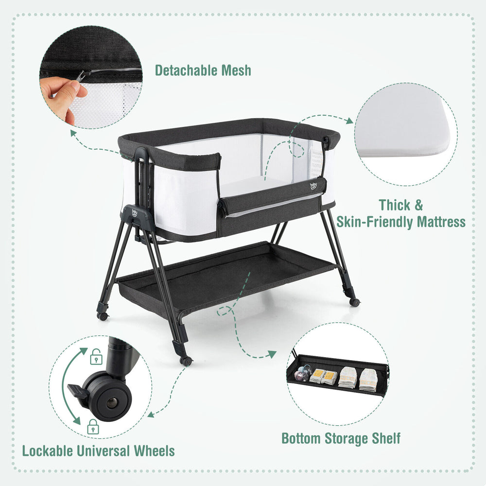 Portable bedside sleeper for baby in black with adjustable heights, lockable wheels, and bottom storage shelf for.