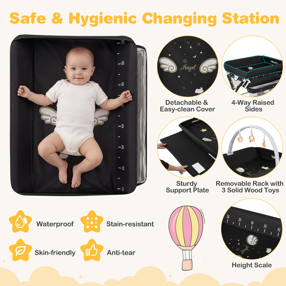 Foldable baby changing table in black with detachable cover, storage bag, and adjustable height for convenience.