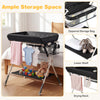 Foldable black baby changing table with zippered storage bag, lower shelf, and drying rack for convenient diaper.
