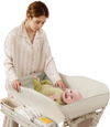 Baby diaper changing table with detachable water basin in green, featuring adjustable height and ample storage for.