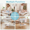Foldable beige diaper changing table with side basket, safety features, and multi-functional design for easy baby care.
