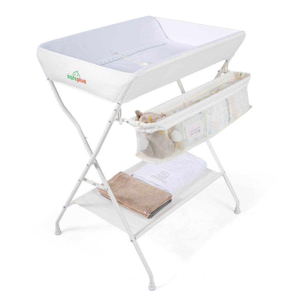 Foldable beige diaper changing table with side basket, waterproof PVC fabric, and height ruler for easy baby care.