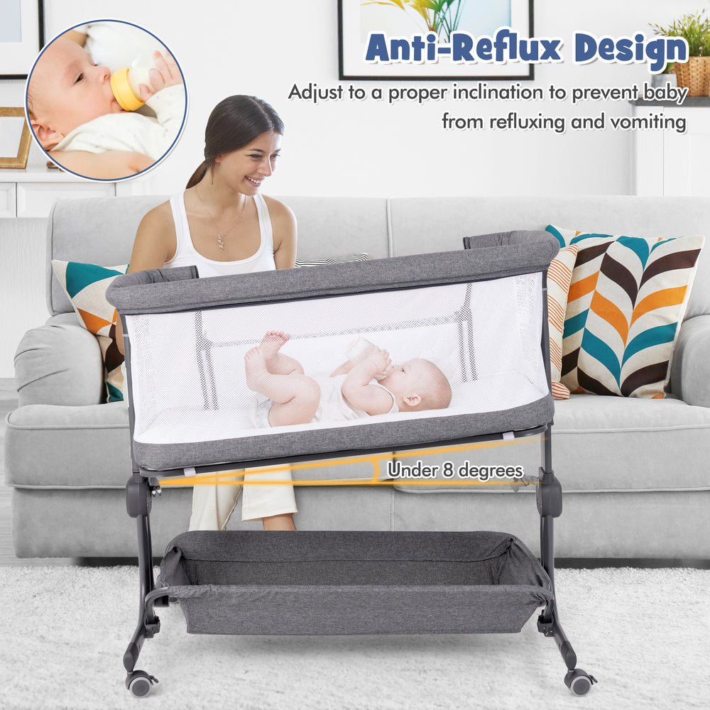 Baby bassinet bedside sleeper in gray with anti-reflux design, adjustable height, and bottom storage for baby.