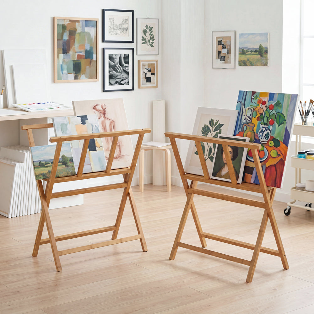 Bamboo art print rack features X-shaped support legs and a middle shelf for displaying canvases and artwork up to 34" x 19".