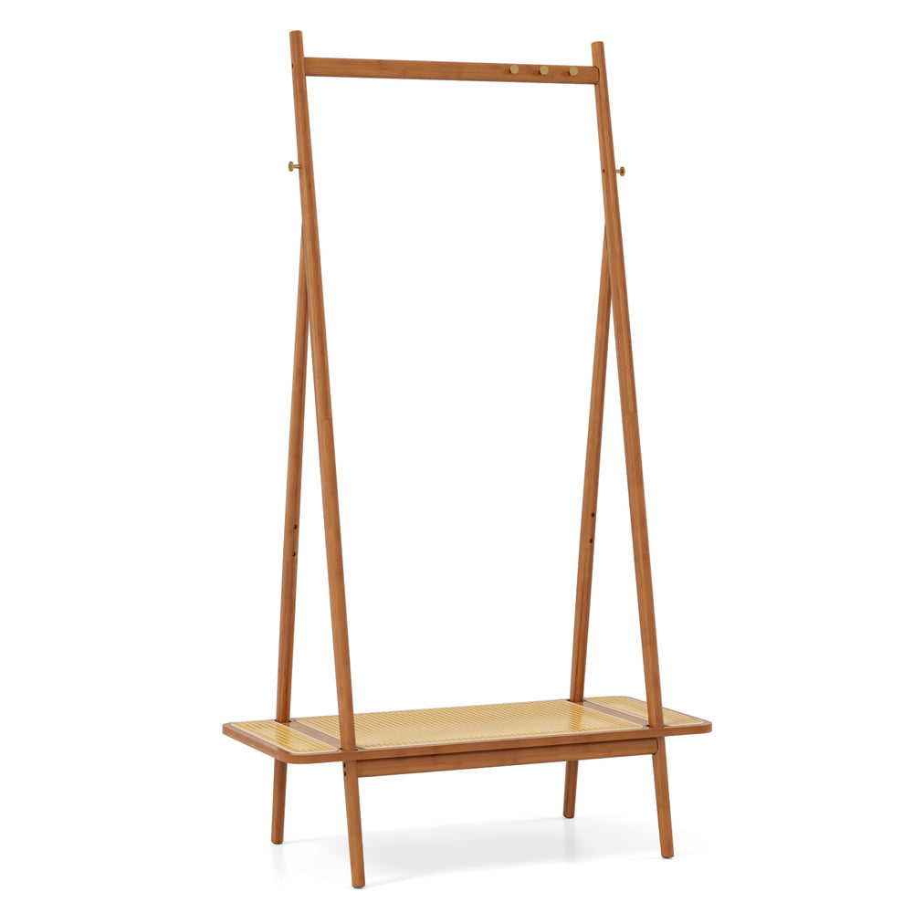 Bamboo clothes rack with rattan shelf and copper hooks, featuring a sturdy design for entryway or bedroom storage.