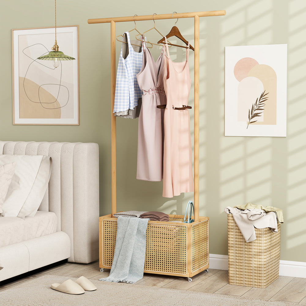 Bamboo clothes rack with rattan storage basket and wheels, perfect for stylish organization in any room.