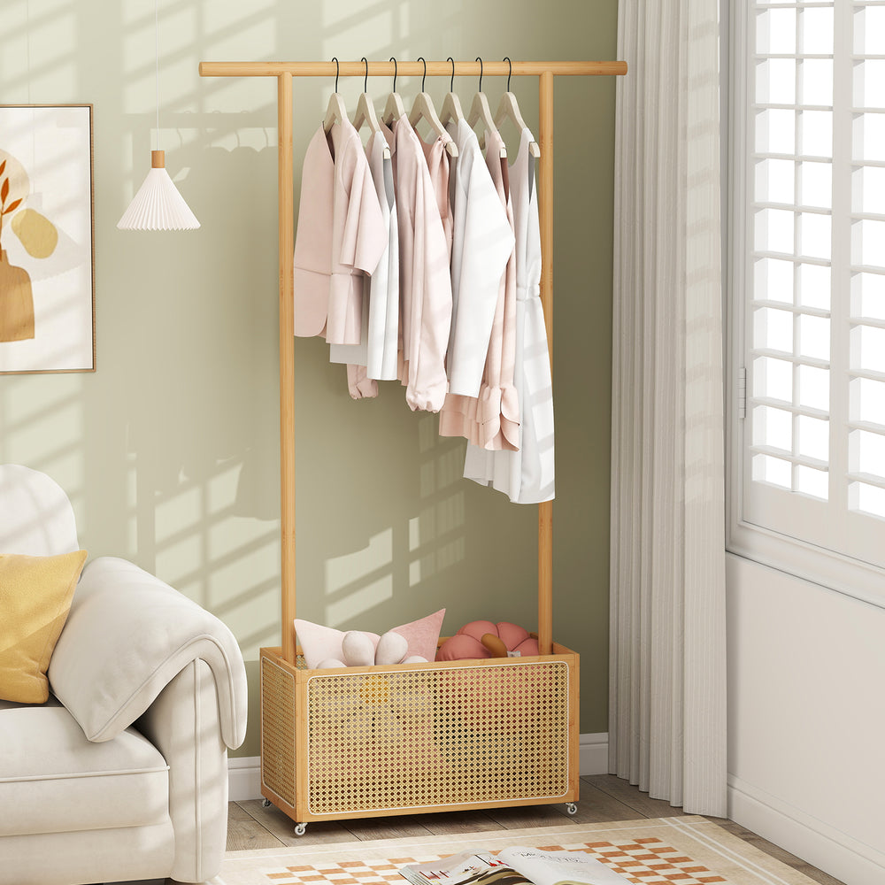 Bamboo clothes rack with hanging rod and rattan storage basket on wheels, perfect for entryway or living room.