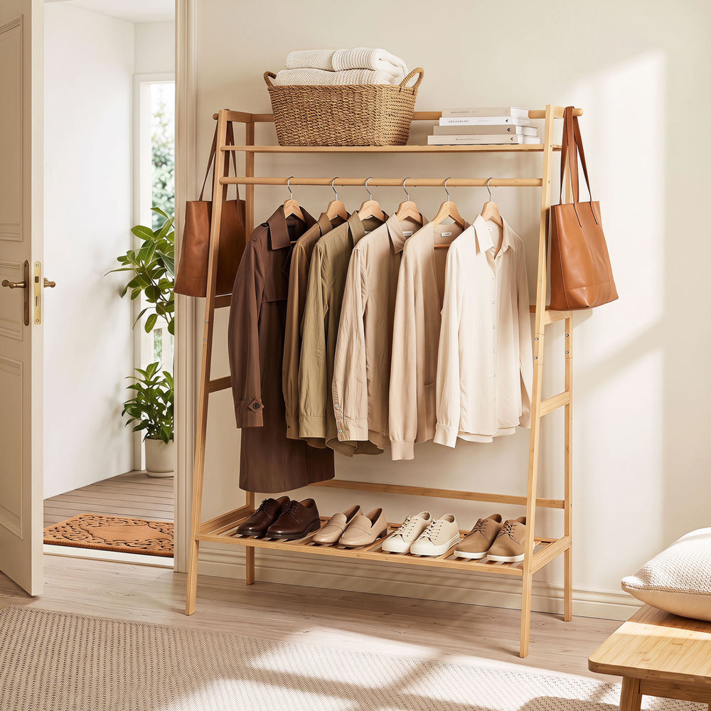 Bamboo clothing garment rack with hanging rod, two shelves, and side hooks, perfect for organizing your entryway or bedroom.