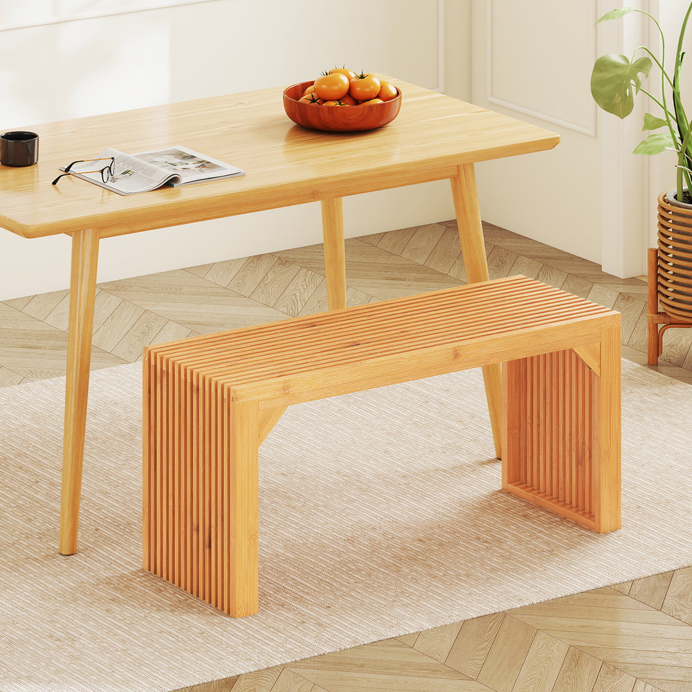 Bamboo dining bench with slatted top, 36" long, perfect for indoor or outdoor use, adds sophistication to any space.