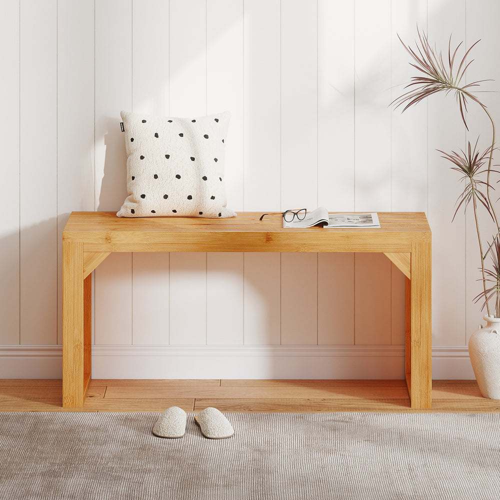 Bamboo dining bench with slatted top, 36" long, ideal for entryways or dining areas, showcasing natural wood finish.