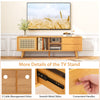 Bamboo TV stand with rattan and glass doors, featuring cable management holes and convenient handles for elegant.