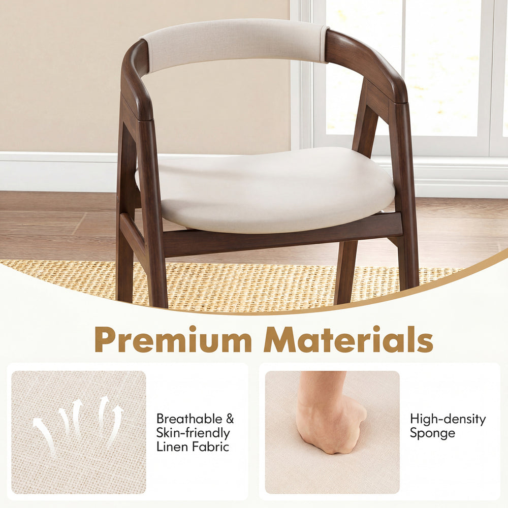 Bamboo upholstered dining chair with curved back, featuring breathable linen fabric and high-density sponge for comfort.