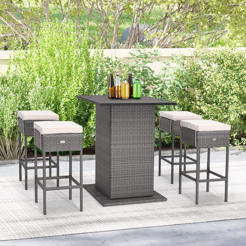 5-piece outdoor wicker bar table set with hidden storage, featuring soft cushions and ergonomic footrests for patio use.