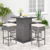 5-piece outdoor wicker bar table set with hidden storage, soft cushions, and ergonomic footrests for patio relaxation.