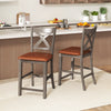 Set of 2 gray bar stools with cross back and faux leather upholstered seats for stylish kitchen seating.