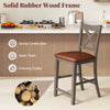Gray bar stool with cross back and faux leather seat, featuring a solid rubber wood frame for sturdy construction.