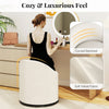 Beige barrel chair with curved backrest and hidden storage, upholstered in soft velvet for a cozy vanity experience.