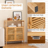 Bamboo bathroom floor storage cabinet with slatted doors, open shelf, and elevated legs for ventilation and easy access.