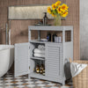 Freestanding gray bathroom cabinet with double shutter doors, adjustable shelves, and open storage for towels and.