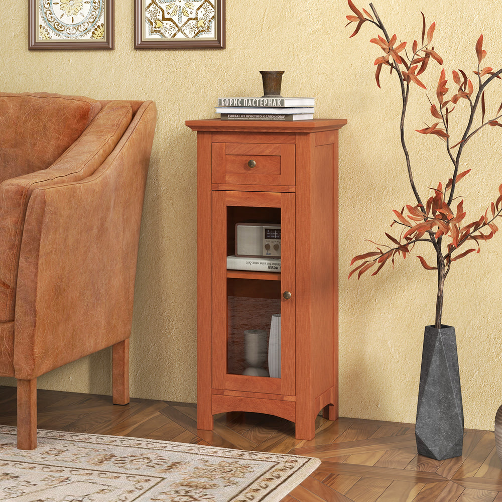 Freestanding brown storage cabinet with glass door, drawer, and adjustable shelf for versatile organization in any room.