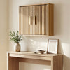 Bathroom wall cabinet with slatted doors and adjustable shelves, perfect for space-saving storage in any room.