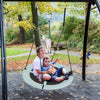 Kids enjoying the 40-inch saucer tree swing made of 900D Oxford fabric, perfect for outdoor fun and balance skills.