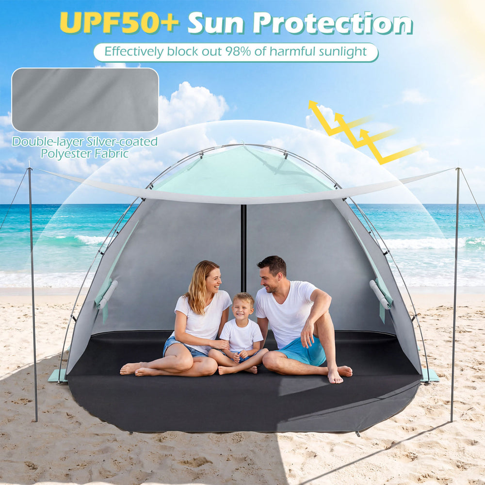 Beach tent sun shelter with UPF50+ protection, spacious interior for 5-6 people, and easy pop-up setup on the sand.