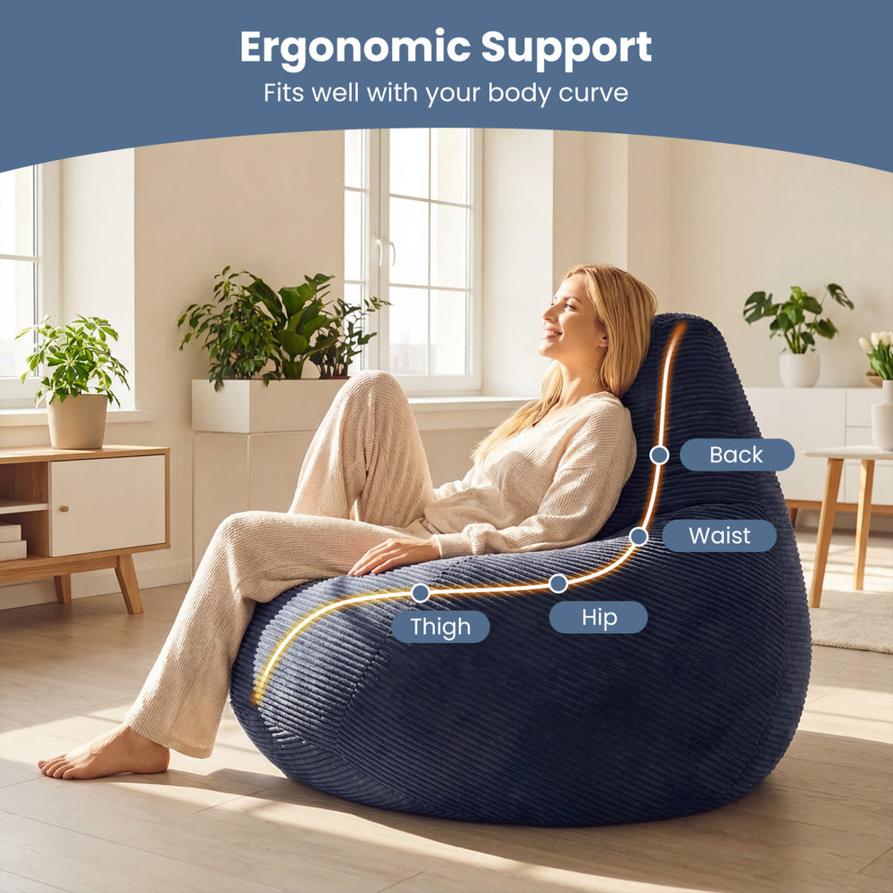Bean bag chair in blue with ergonomic support, featuring a soft corduroy cover and ample seating for relaxation.