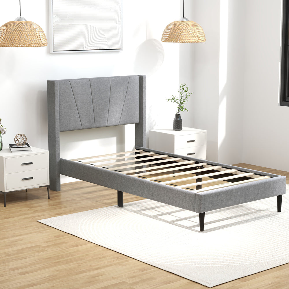 Twin bed frame with linen upholstered wingback headboard, sturdy construction, and under-bed storage space.