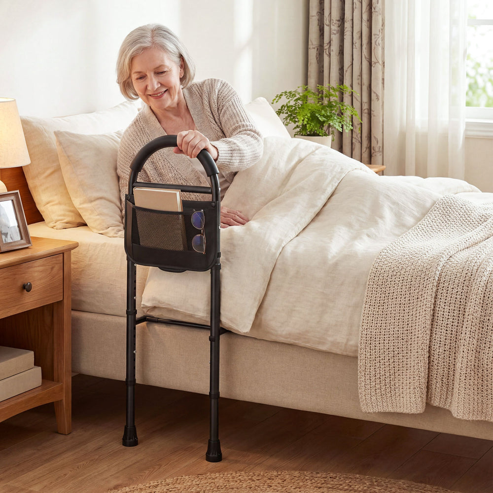 Height adjustable bed assist railings with padded handrail and storage pocket for elderly safety and support.