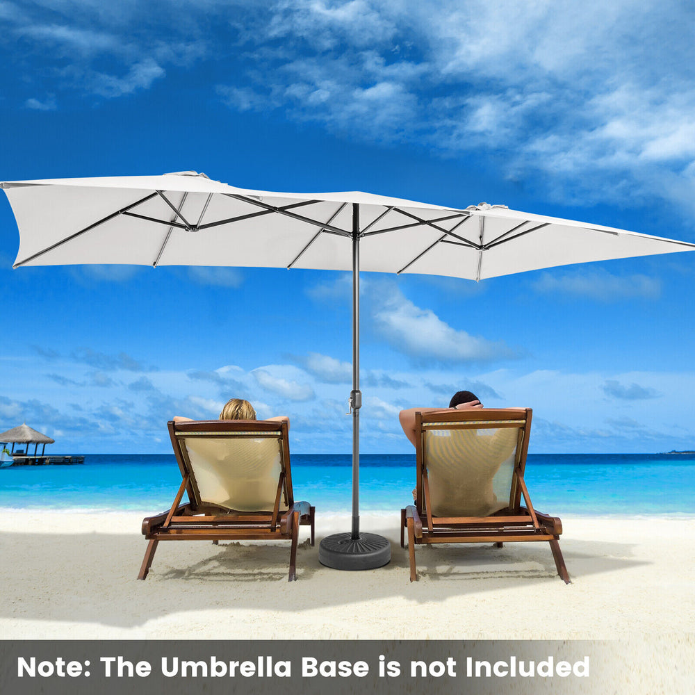 Double-sized 15 feet beige patio umbrella with crank handle and vented tops, providing ample shade for outdoor.