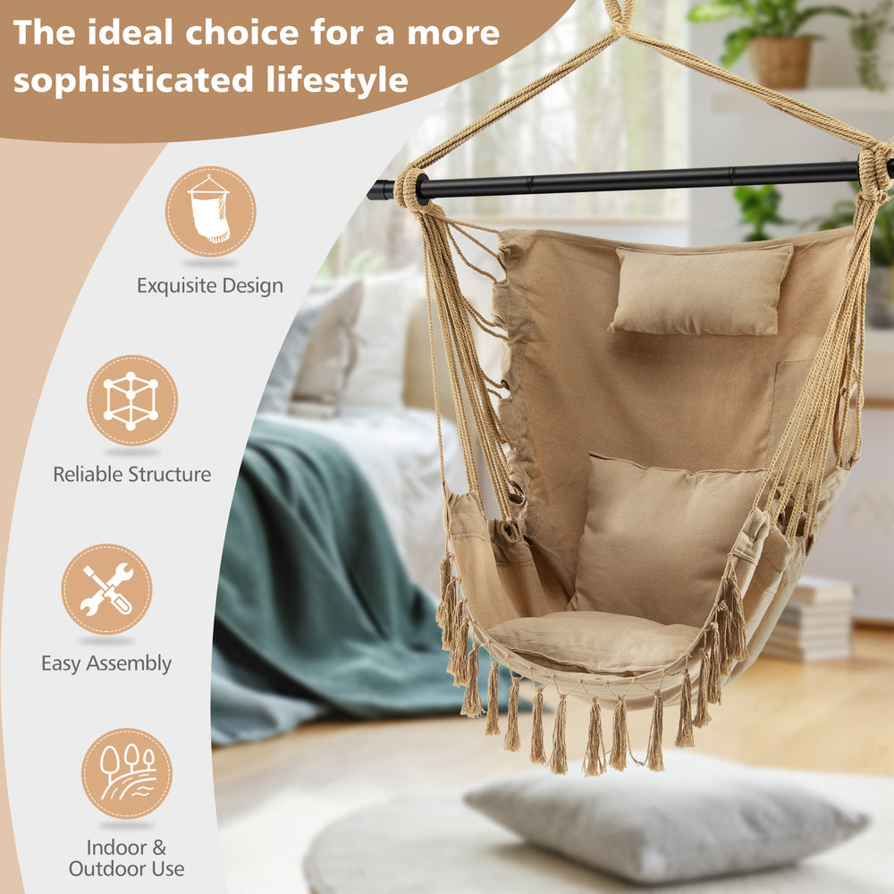 Hanging rope swing chair in beige with soft pillow and cushions, featuring elegant tassels for indoor and outdoor use.